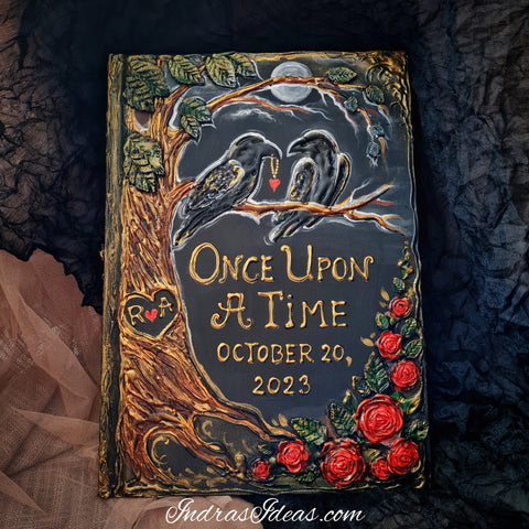 Two loving ravens on a tree. Black wedding guest book with two crow and red roses. Large book and set