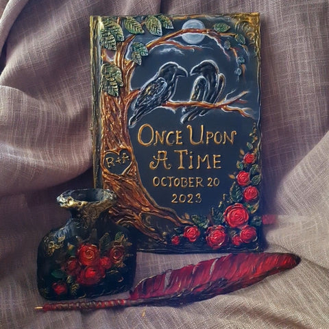 Two loving ravens on a tree. Black wedding guest book with two crow and red roses. Large book and set