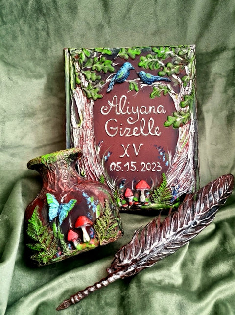 A personalized tree trunk keepsake box set displayed on a draped olive green fabric background. The set includes a main trunk box with custom names 'Aliyana Gizelle' and wedding date '05.