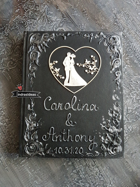Wedding couple in a heart, Black Guest Book with a Bride and Groom silhouettes. S Books.