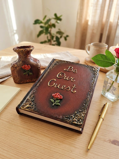 Handcrafted 3D sculpted Be Our Guest wedding guest book with gold feather pen and pen holder