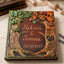 Handheld custom woodland wedding guest book featuring sculpted fall leaves and rustic tree trunk detailing.