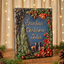 Handmade personalized 3D A decorative hardcover book titled "Santa's Christmas Tales" placed on a wooden surface; festive greenery, pine cones, and a string of warm lights are visible in the background.