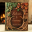 Personalized Fall wedding guest book with 3D leaves, carved tree bark frame, names, and date.