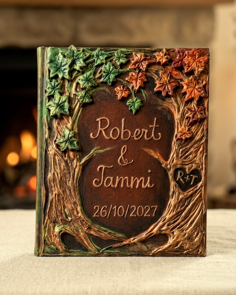 Personalized Fall wedding guest book with 3D leaves, carved tree bark frame, names, and date.