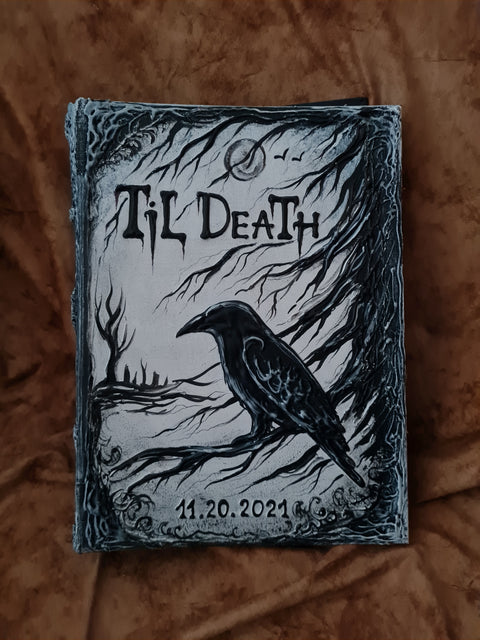 A gothic-style hardcover  handmade journal or notebook with a 3D raven illustration and the text 'Til Death' on the cover