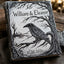 A decorative hardcover book or journal with a dark engraved cover featuring a raven, bare tree branches, and the text 'William & Eleanor' and '10.30.