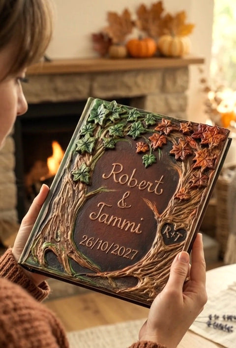 Handheld custom woodland wedding guest book featuring sculpted fall leaves and rustic tree trunk detailing.